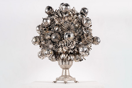 A silver flower bouquet of forks and spoons.